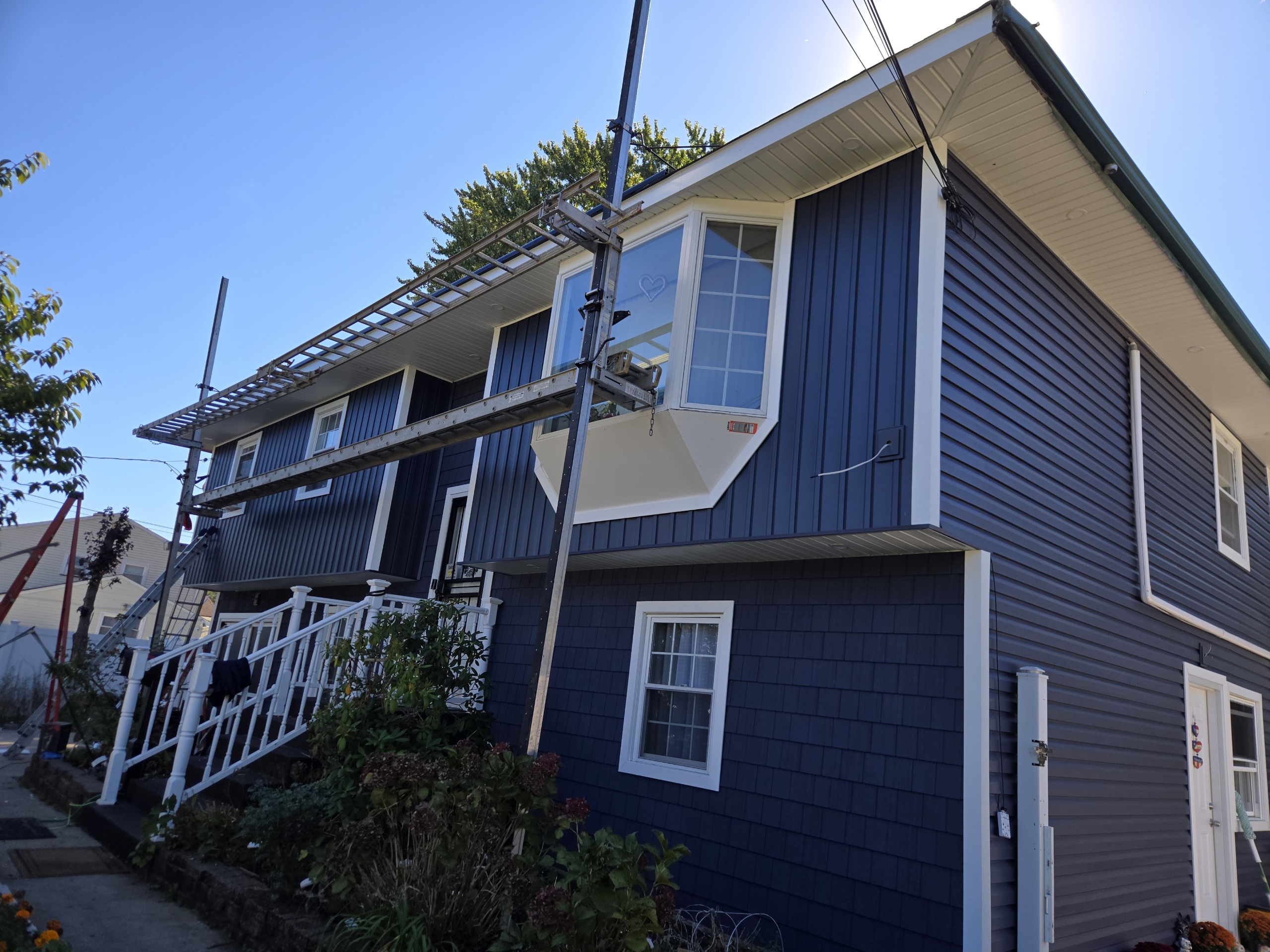 Blue vinyl siding installation Long Island